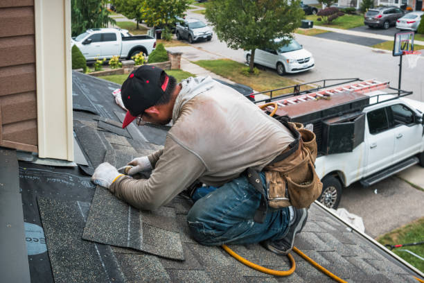 Professional Roof Replacement technician working in Islip, NY